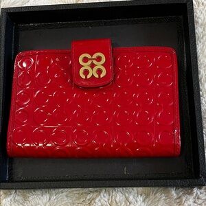 Coach Embossed Red Travel Bag with Gold Accent